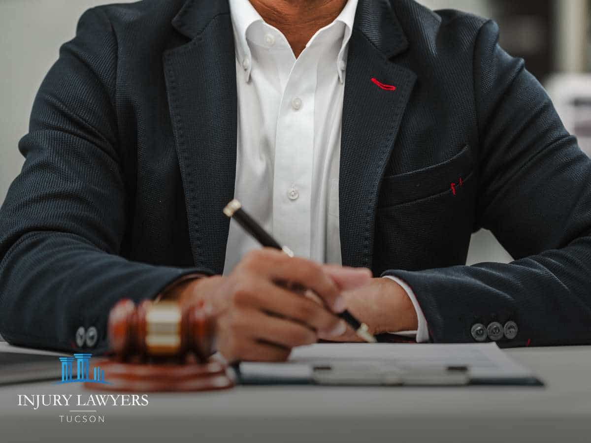 Tucson Pothole Injury Claims attorney reviewing case documents