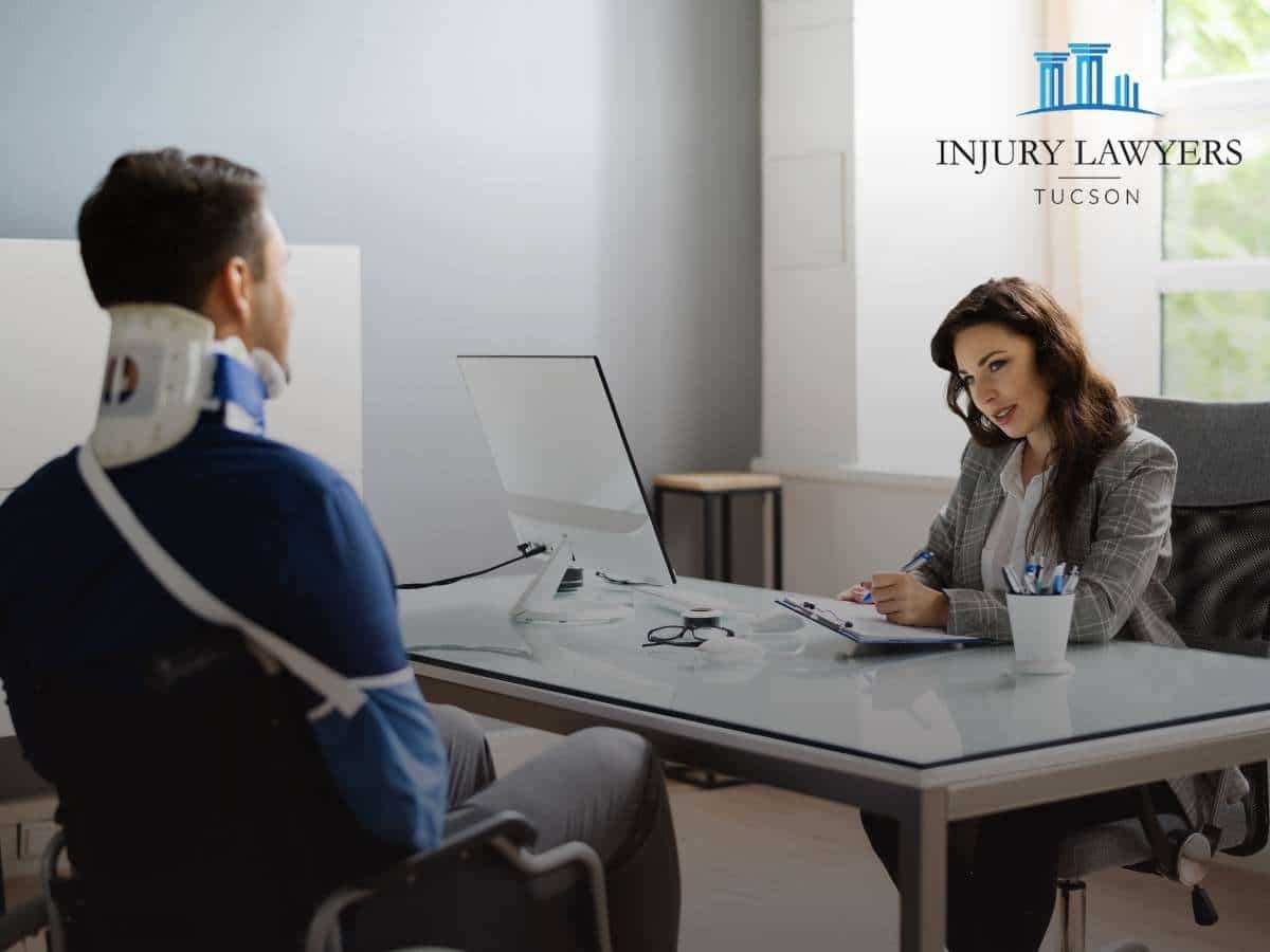 An injury lawyer helping her client file his personal injury claim in Tucson, AZ.