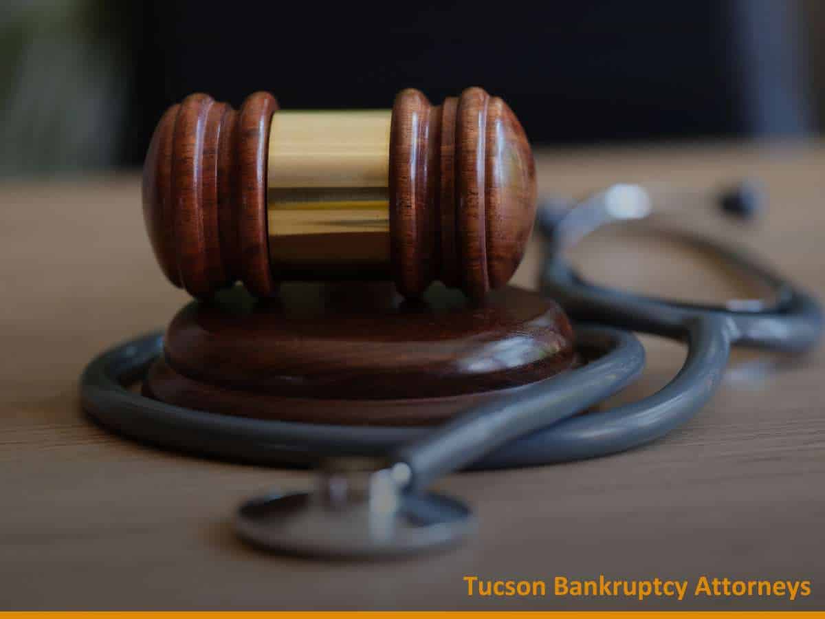 Wooden gavel and stethoscope representing Tucson Bankruptcy Attorneys specializing in personal injury claims